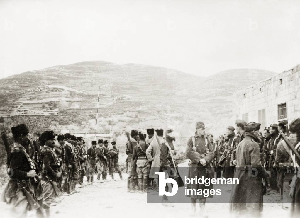Image of Photography depicting Border checkpoint in Arabah. Armed Arab police officers guard a border checkpoi