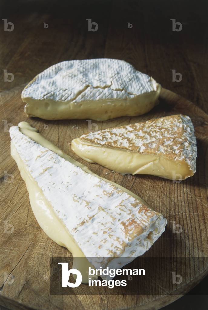 Image of Three different types of ripe French Brie