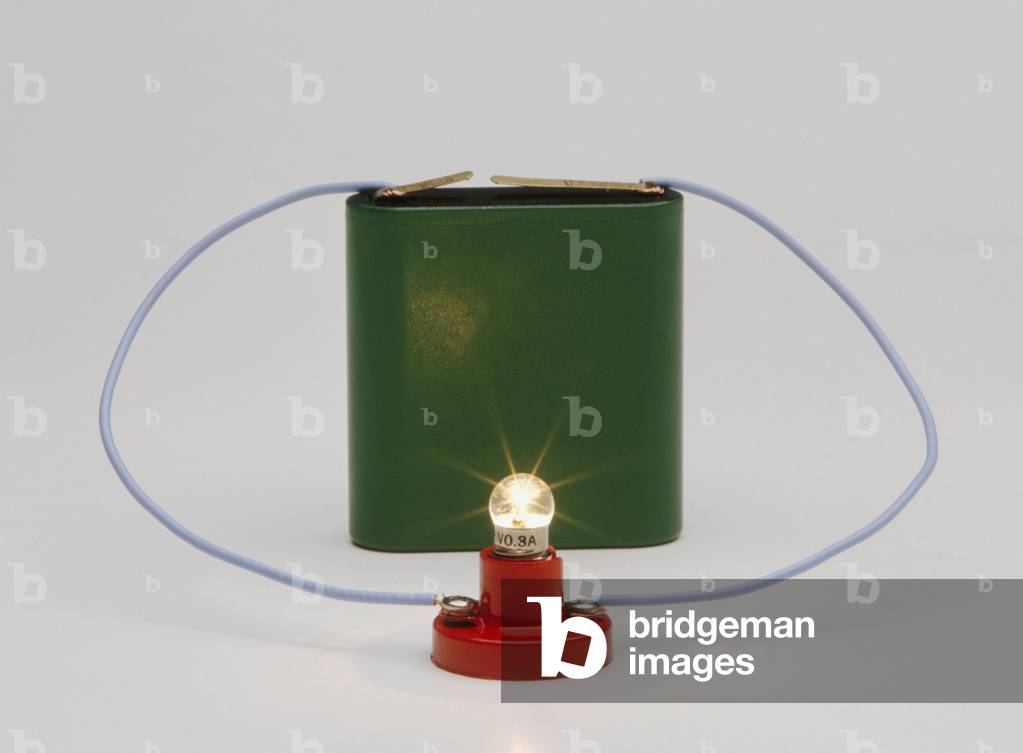Image of Electric circuit, battery connected to light bulb, close-up ...