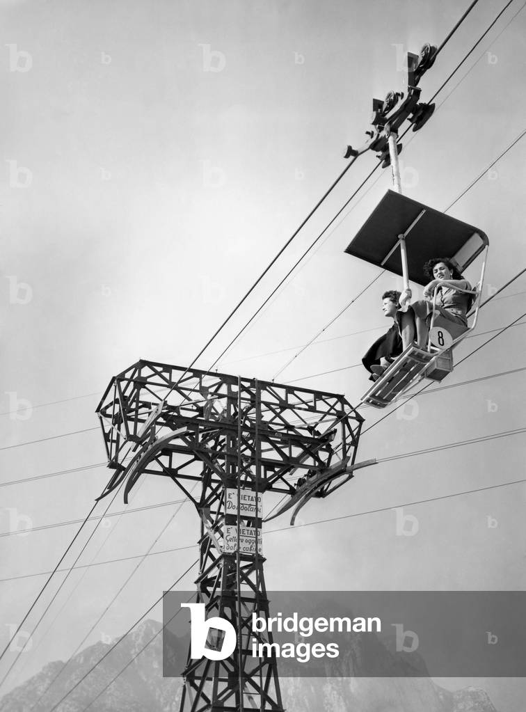 Women on Chair Lift, Lecco, Lombardia, Italy 1954 (b/w photo)