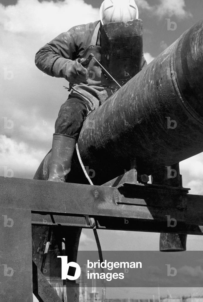 Welder worker, 1960 (b/w photo)