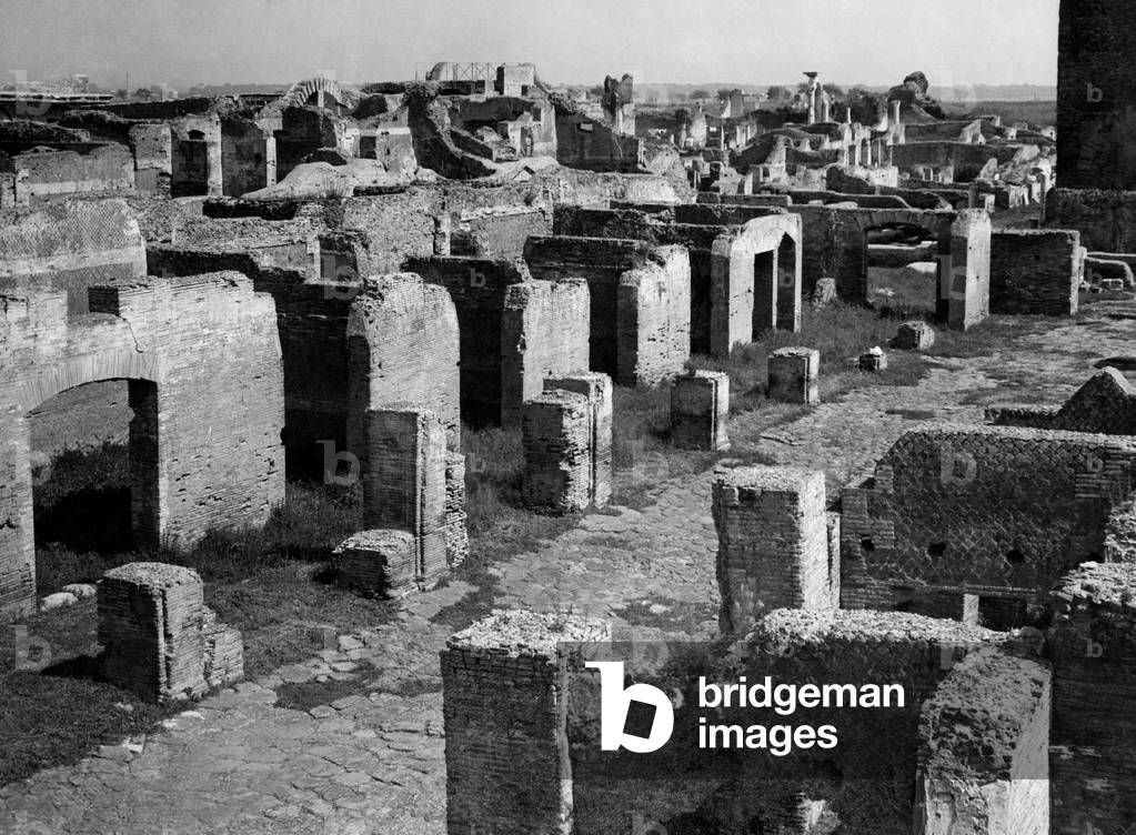 Lazio, street at the capitolium a ostia antica, 1930 (b/w photo)