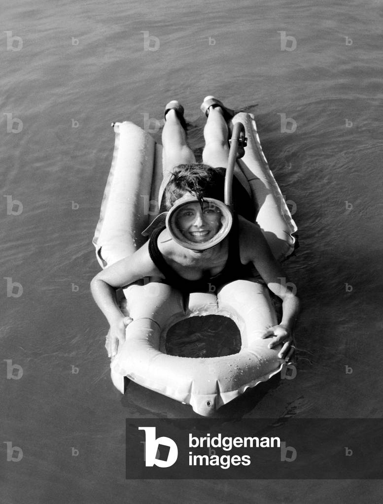 Woman on Airbed, 1960 (b/w photo)