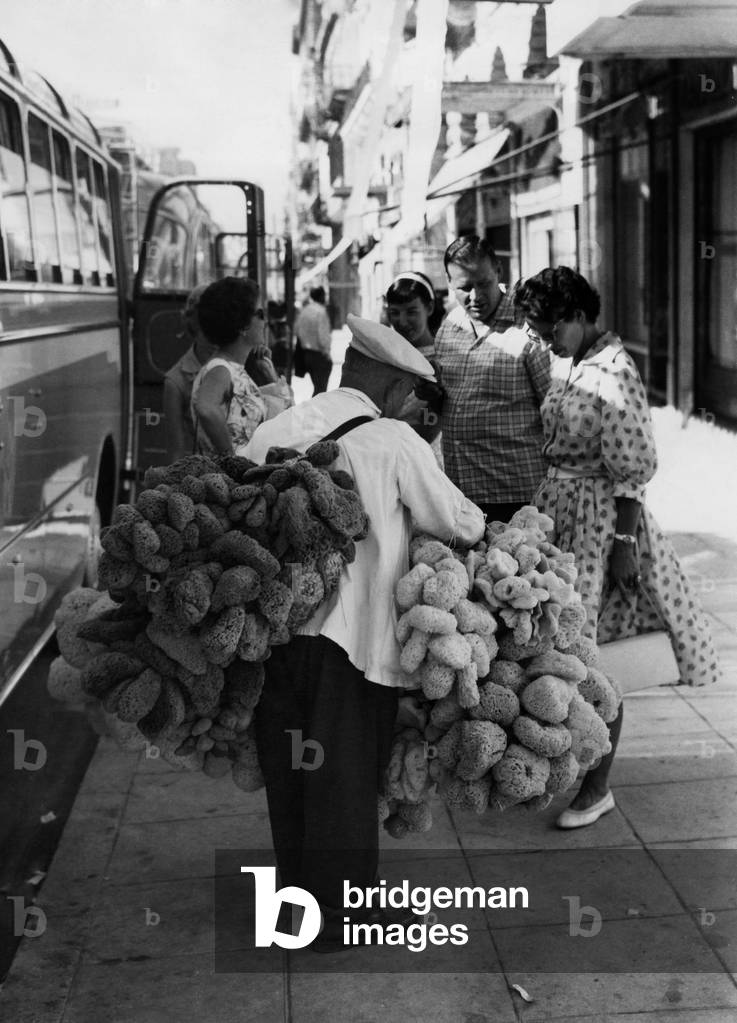 Sponge seller, athens, greece, 1958 (b/w photo)