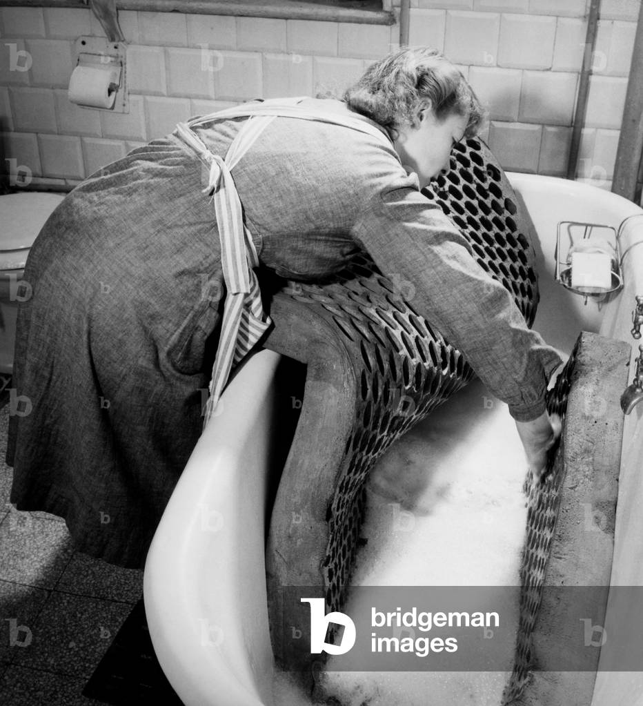 Foam mattress washing, 1948 (b/w photo)