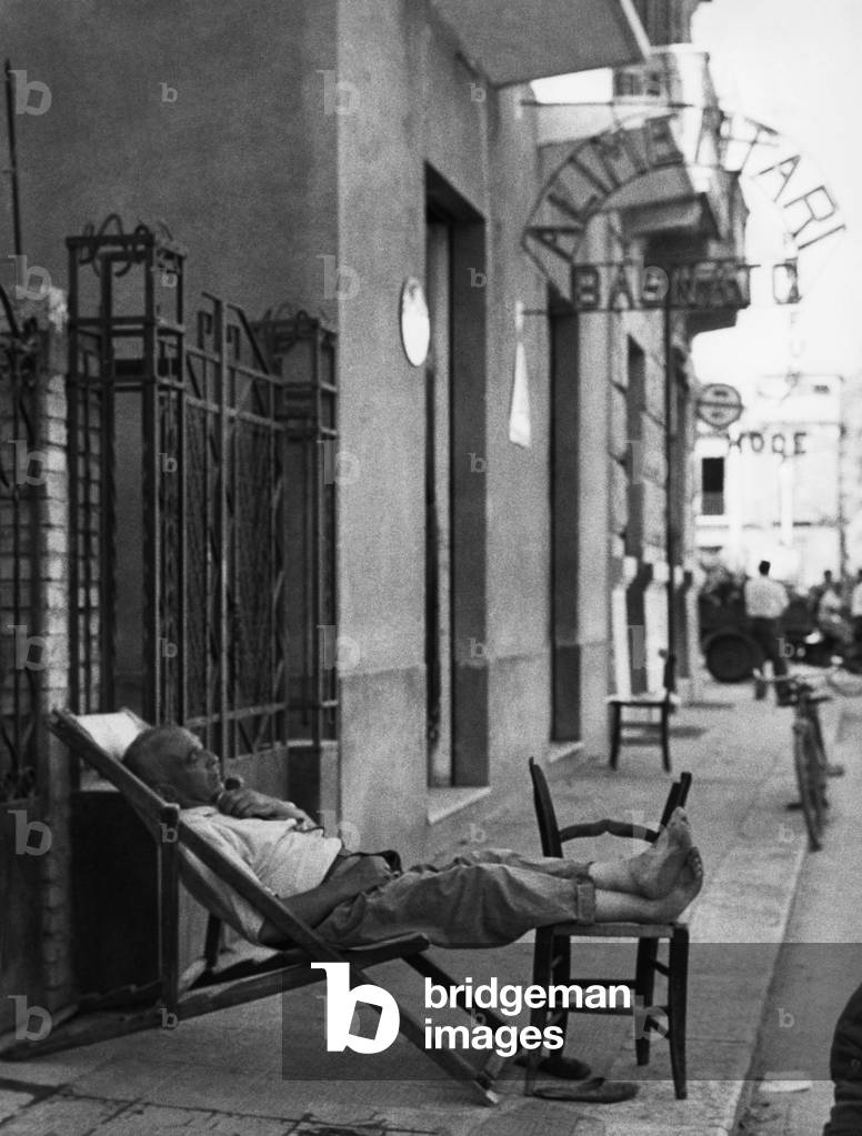 Man Sleeping on the Street, Bagnara Calabra, Calabria, Italy, 1957 (b/w photo)