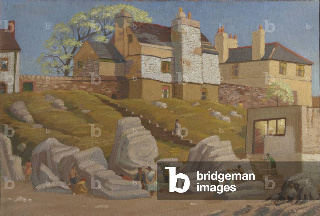 View of Houses above Rocks on a Beach