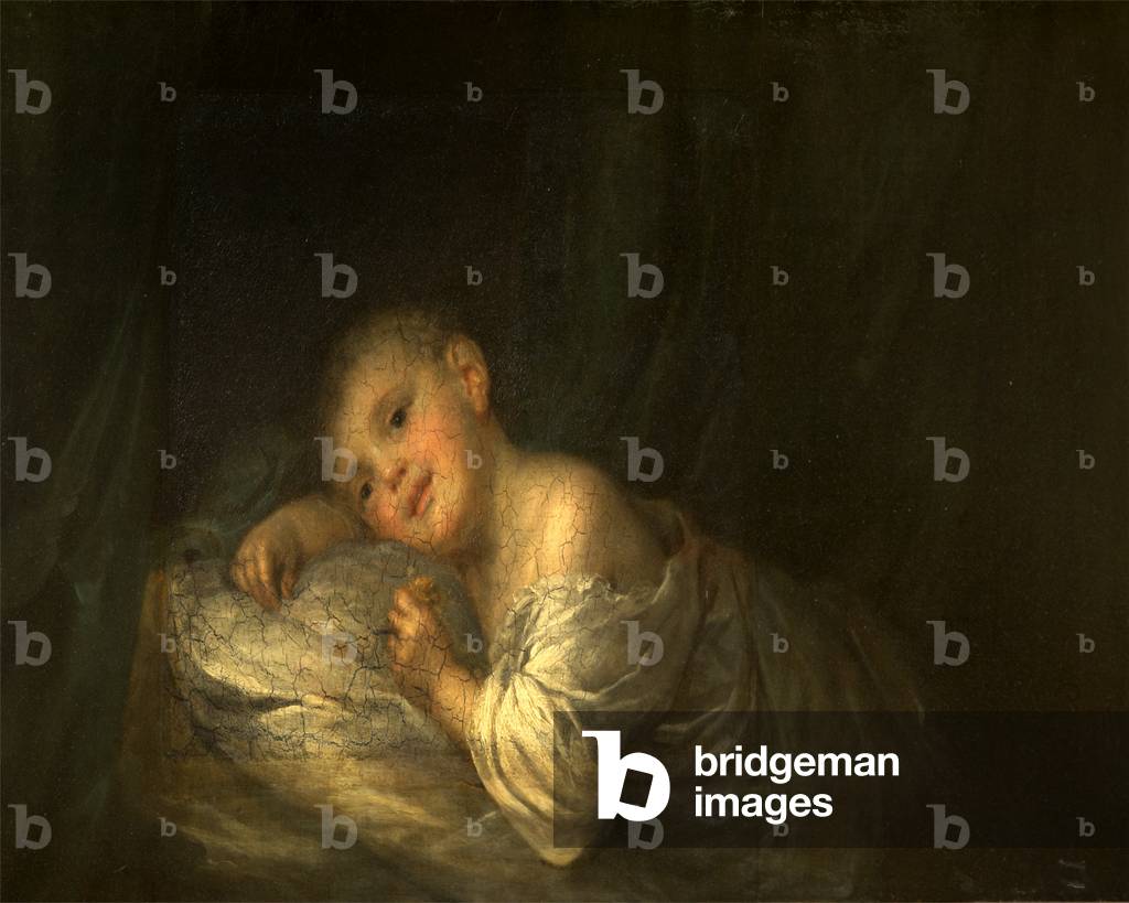 A Child lying on a Bed holding a Flower