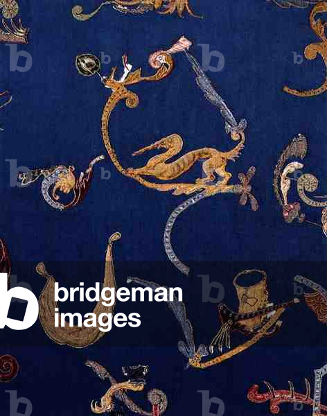 Composite panel of applique grotesques and foliage in the Scott Room passage (textile)