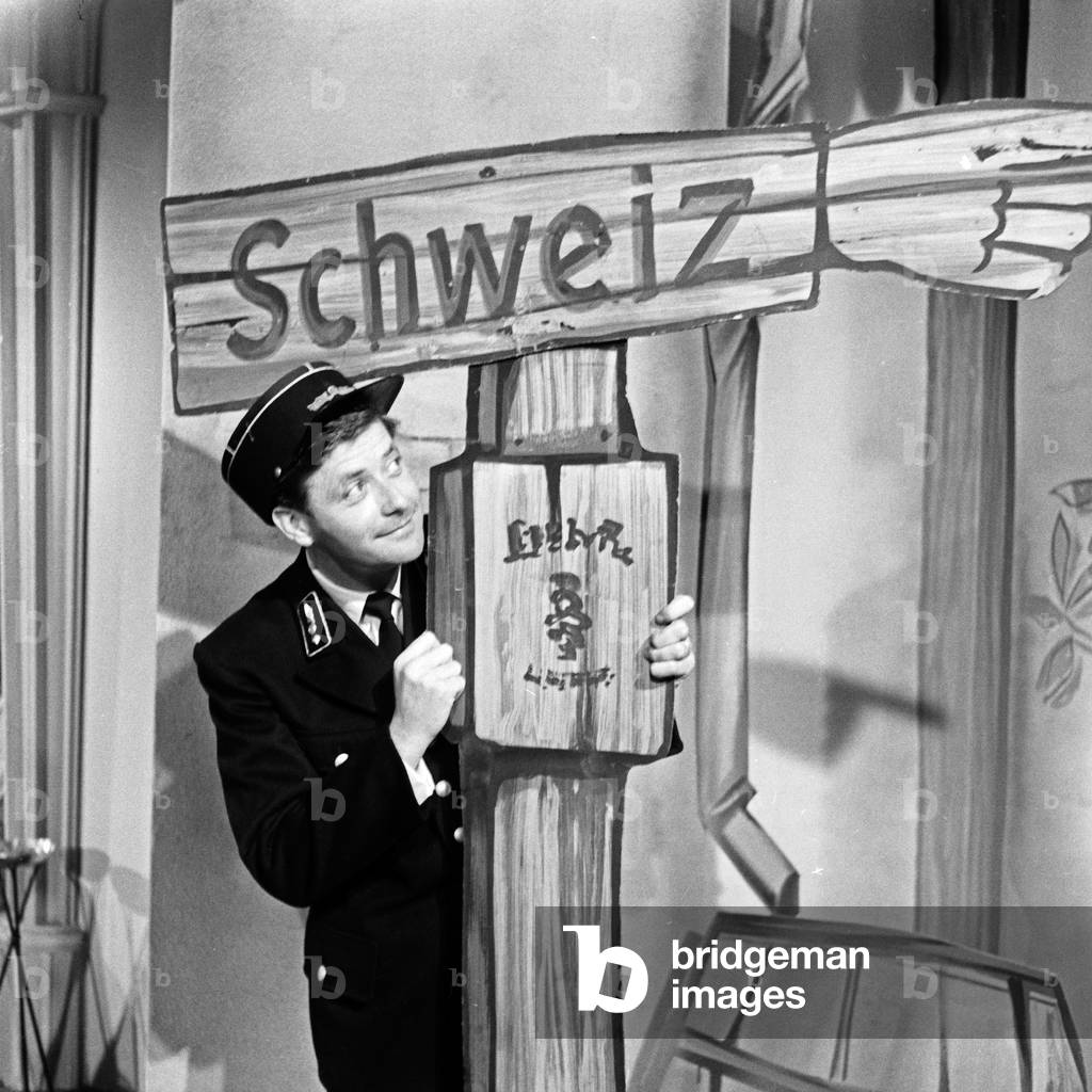 Swiss journalist Guido Baumann acting as border patrol man, Germany 1950s