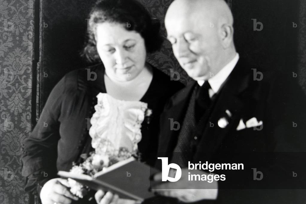 The parents of an extended family at the concession oh the Honour Cross, Germany 1930s (b/w photo)