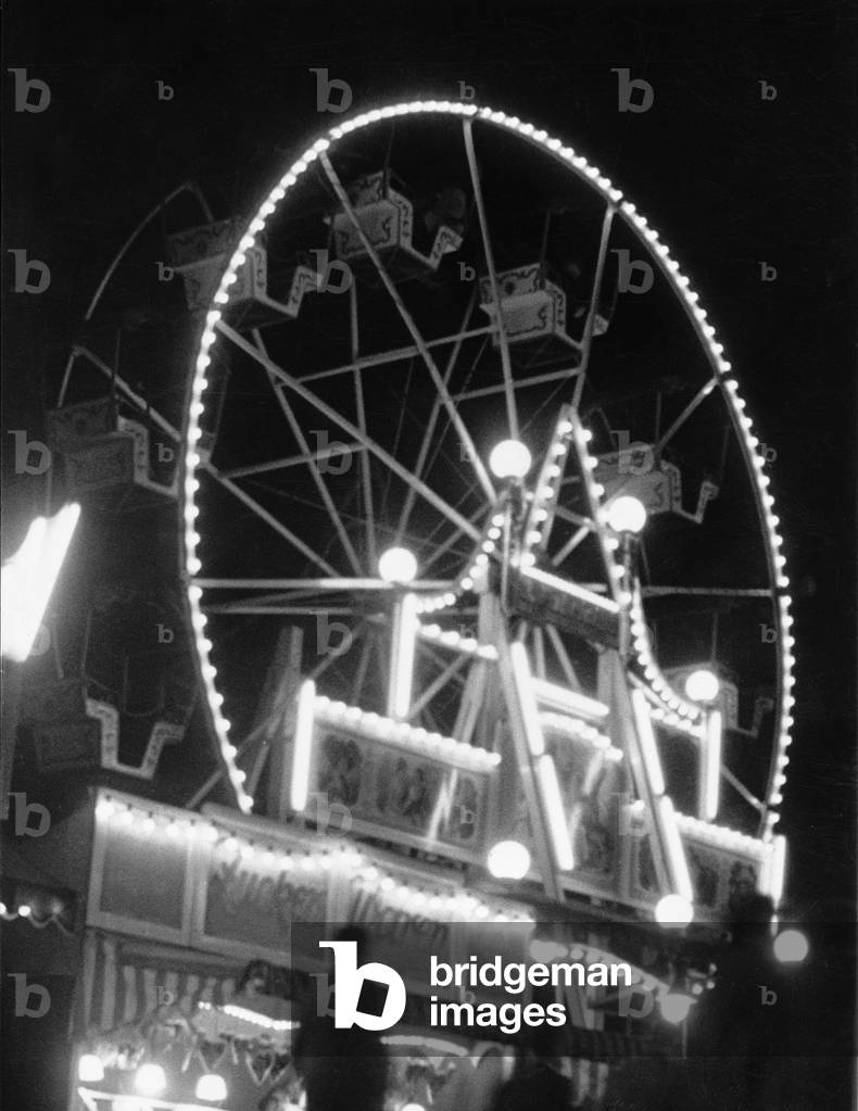 A Ferris wheel with a candy shop in Hamburg, 1950s