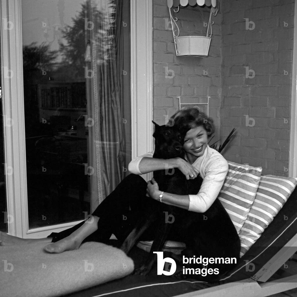 German actress Gisela Griffel with her Doberman hound, Germany 1950s