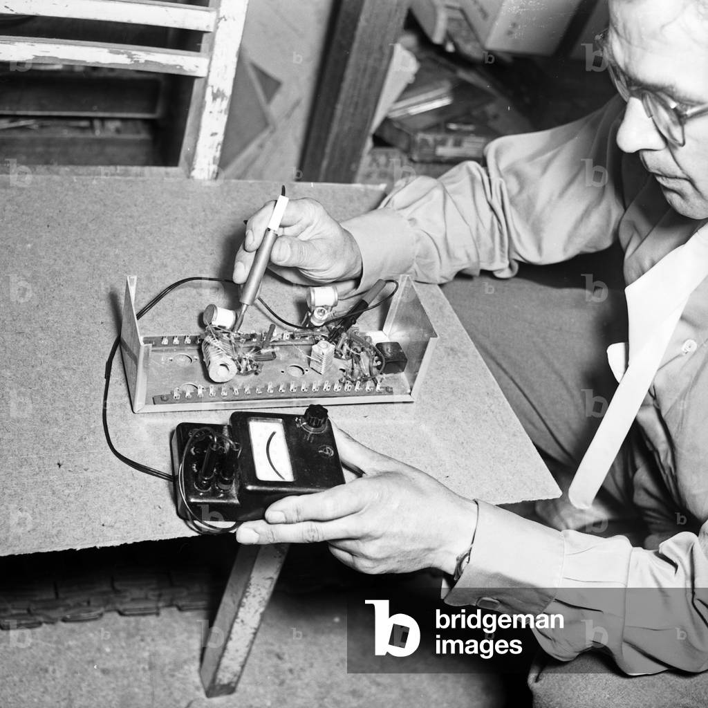 Eletronic check while constructiong a model plane at Hamburg, Germany 1950s