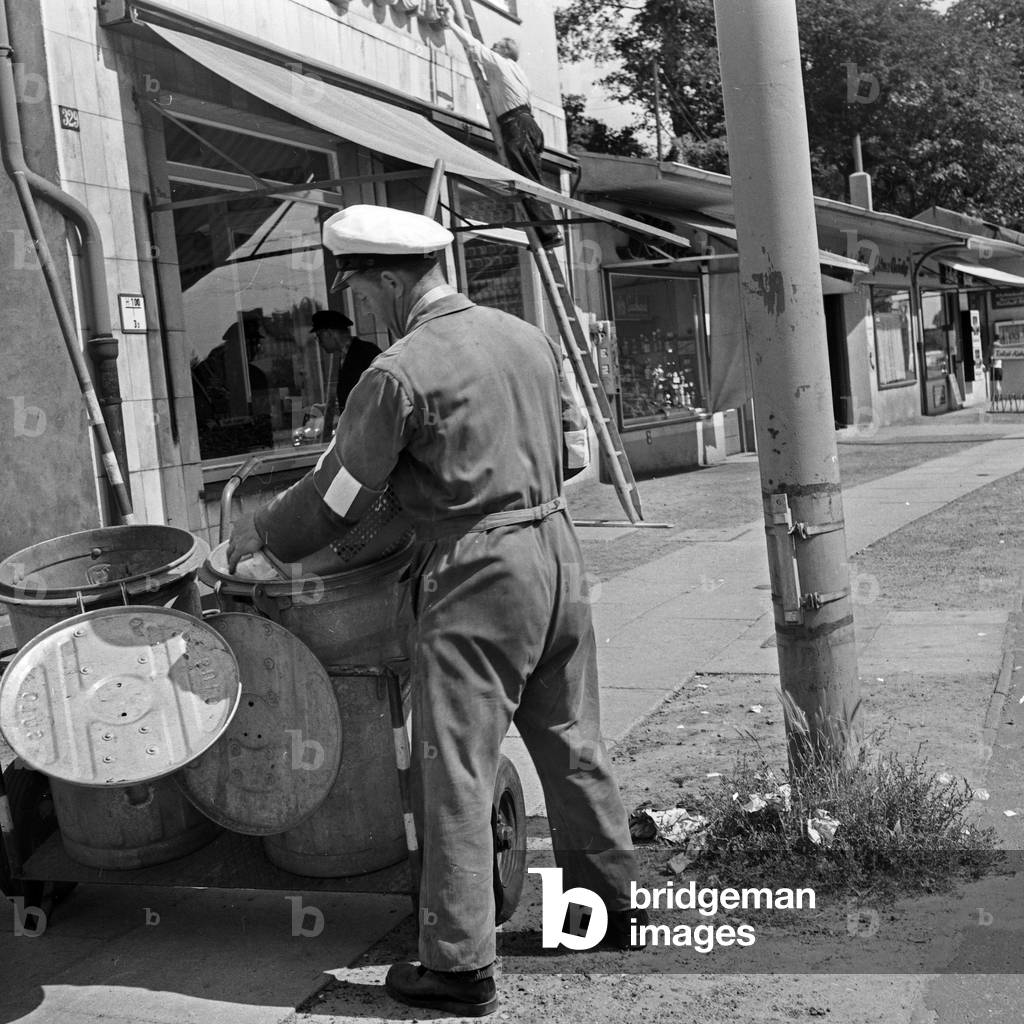 Men of the public street cleaning on the streets of Hamburg, Germany 1960s