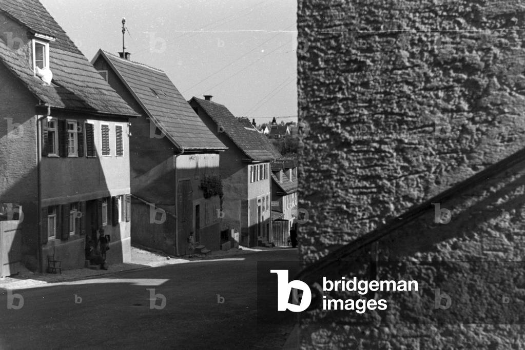 Old houses in a street, Germany 1930s (b/w photo)