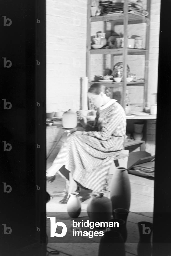 A porcelain painter at work, Germany 1930s (b/w photo)