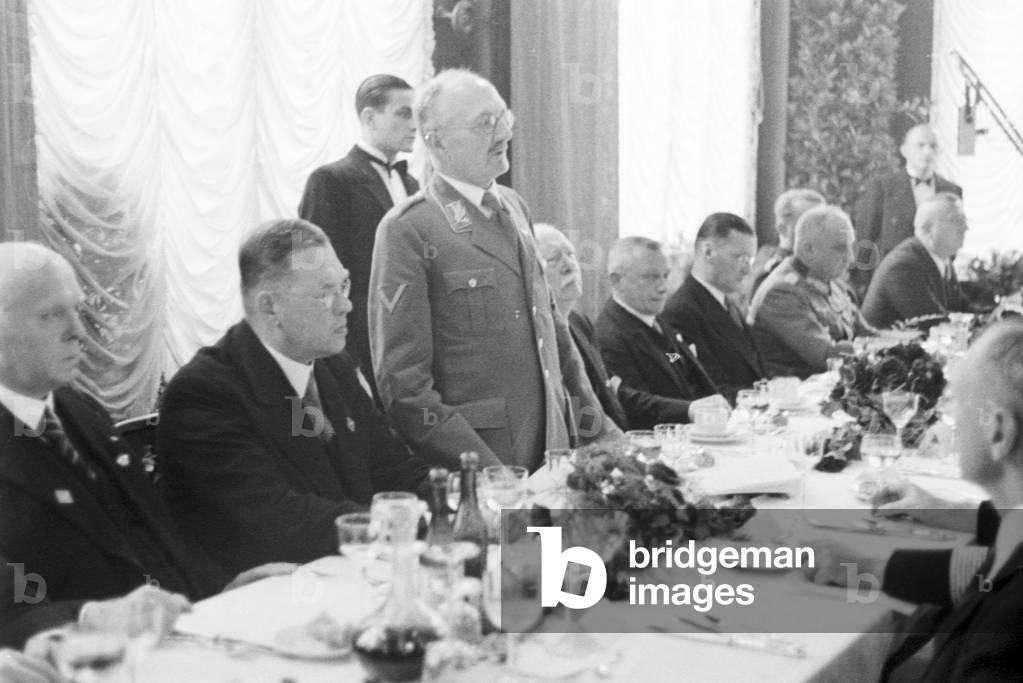 Speaker at the banquet after the Diesel anniversary ceremonial act at the MAN factory at Augsburg, Germany 1930s (b/w photo)
