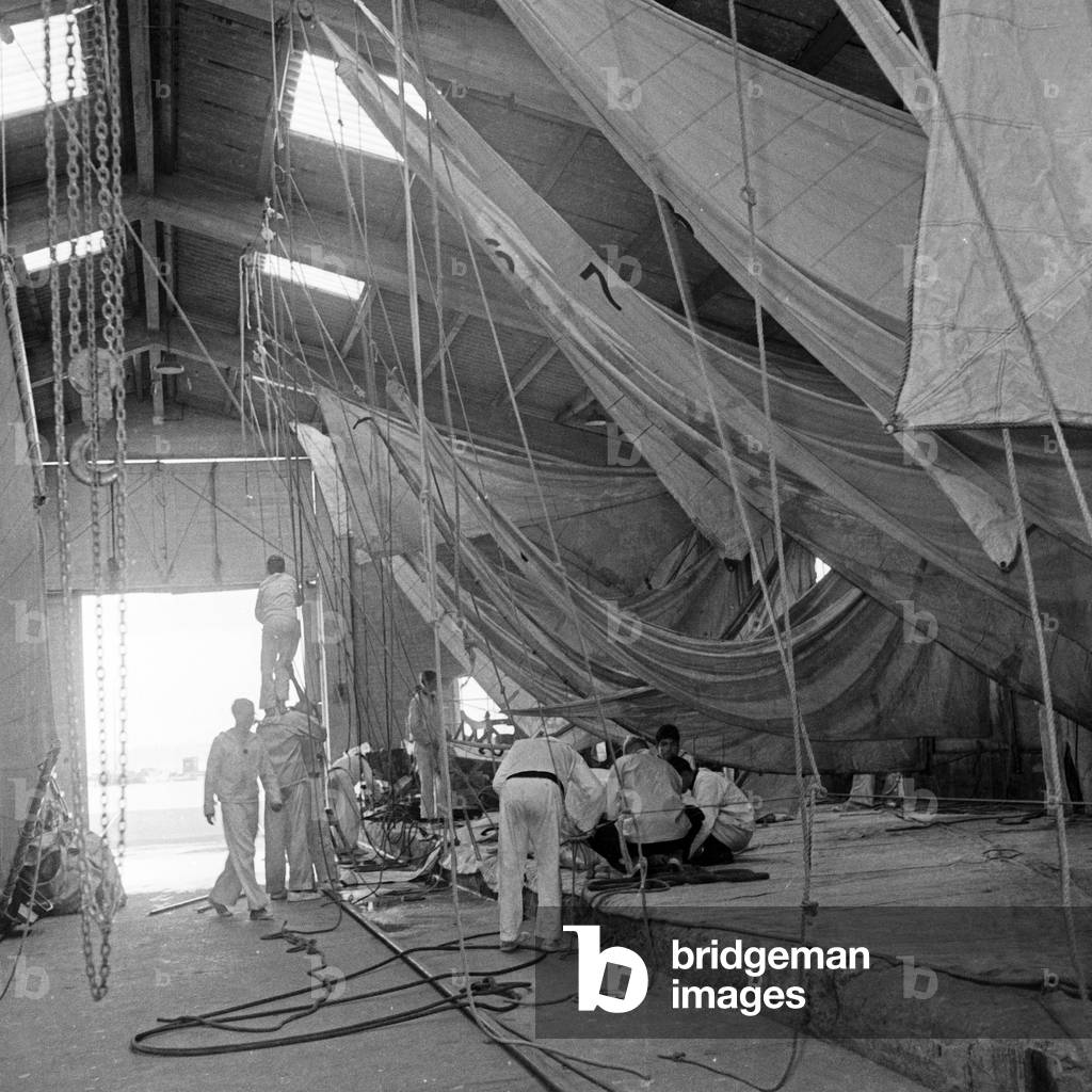 Pupils of the Hanseatic Yachting school exercising on a rigging in a hangar, Germany 1950s