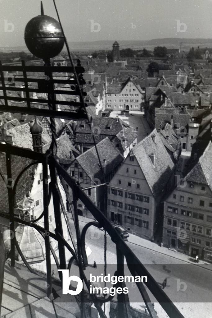 The highest tower of the townhall presents an excellent view over the whole city center and the surrounding natural landscapes of Rothenburg ob der Tauber, Germany 1930s (b/w photo)