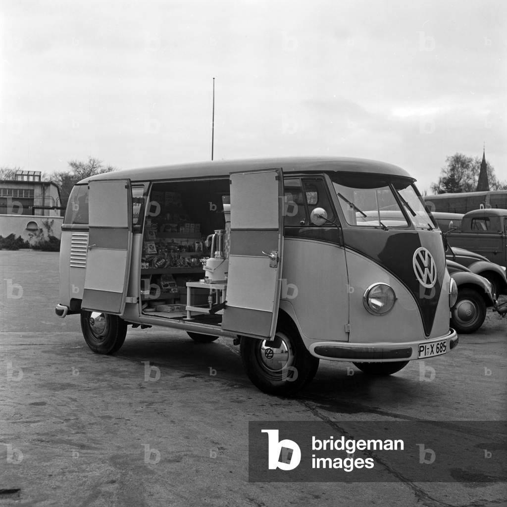 A Volkswagen bus model T1 as a mobile snack bar on the court of Volkswagen favtory at Wolfsburg, Germany 1950s