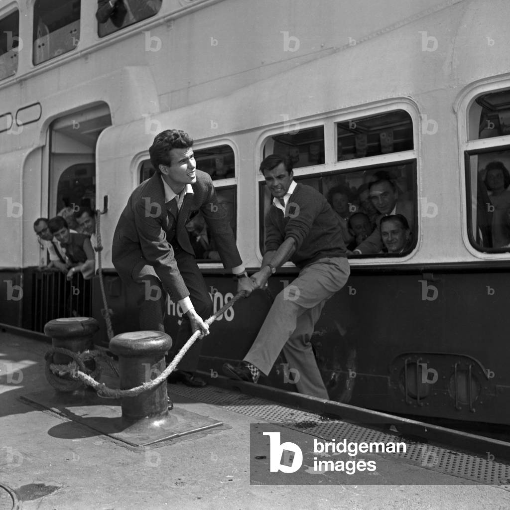 German actor Horst Buchholz and Austrian ski racer Toni Sailer mooring a ship at Hamburg, Germany 1950s