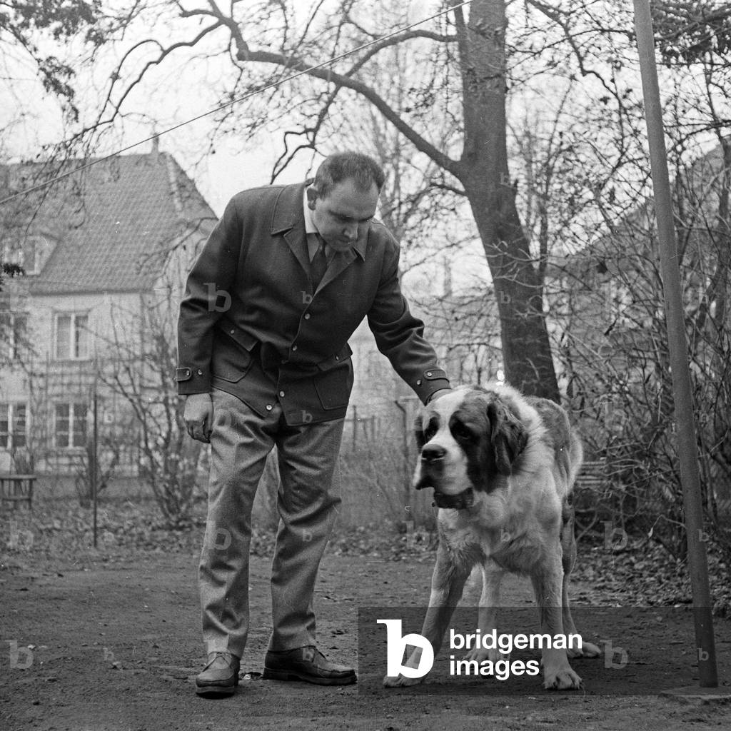 Non-fiction author and journalist Ulrich Klever with a Saint Bernard dog, Germany 1960s