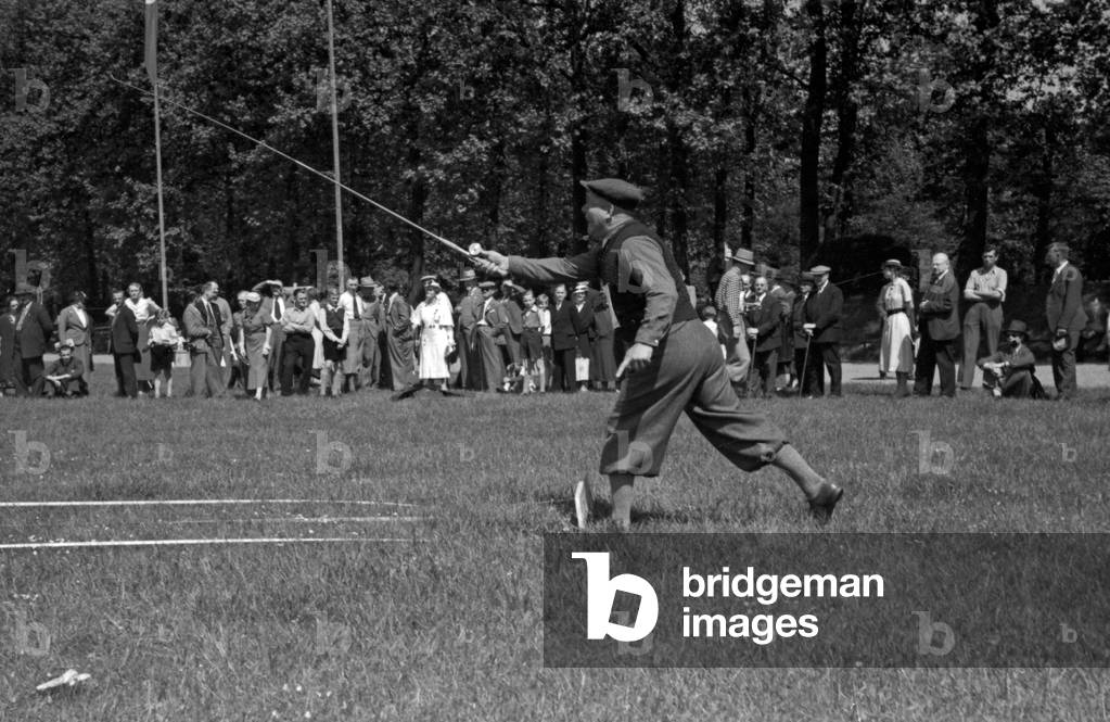A man doing a fry run in angling at a lawn, Germany 1930s (b/w photo)