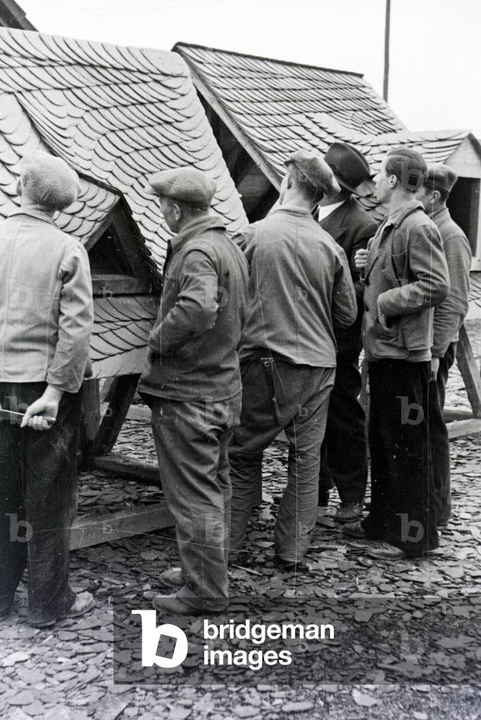 Trainees of a roofer school at a tutorial, Germany 1937 (b/w photo)