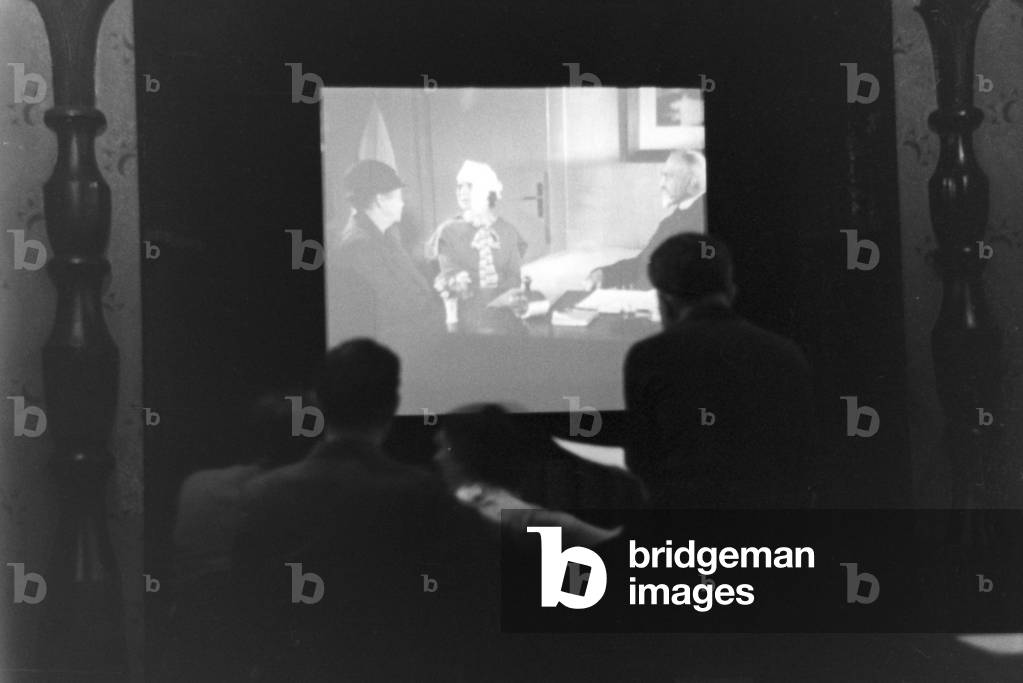 Staff member of a meteorological office watching a movie, Germany 1930s (b/w photo)