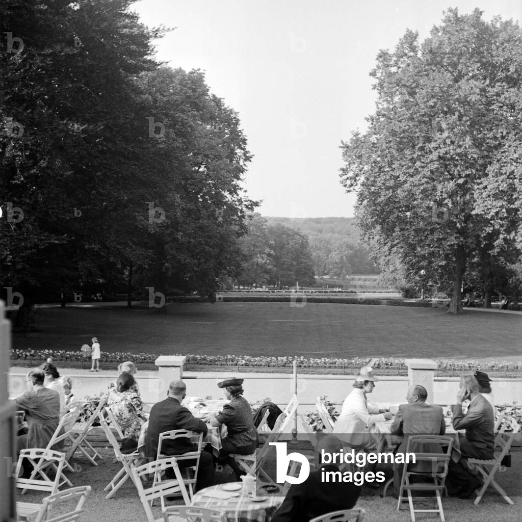 Spa guests on the terrace of the spa resort of Bad Homburg, Germany 1930s (b/w photo)