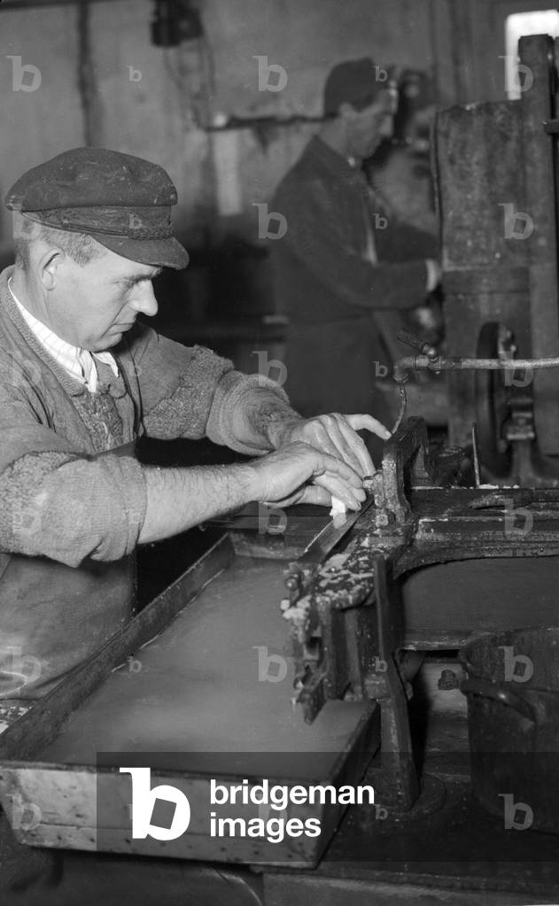 Workers grinding little pieces of ivory, Germany 1954