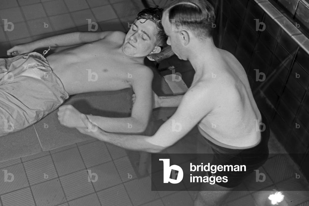 A patient in a therapeutic bath, Germany 1930s (b/w photo)
