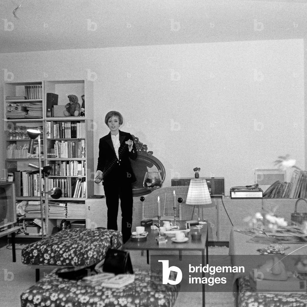 German actress Heidi Mahler at her living room, Germany 1960s