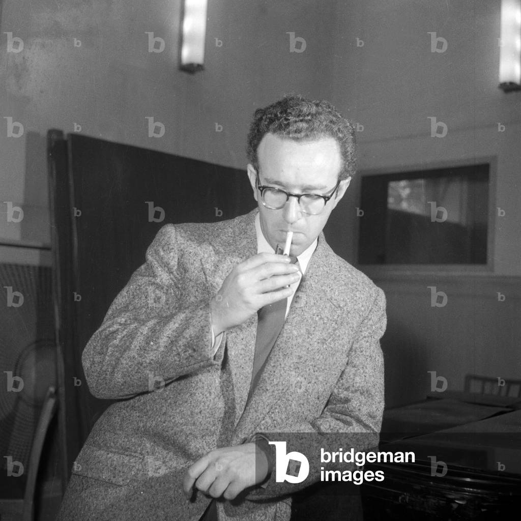 A young man lighting his cigarette, Germany 1954