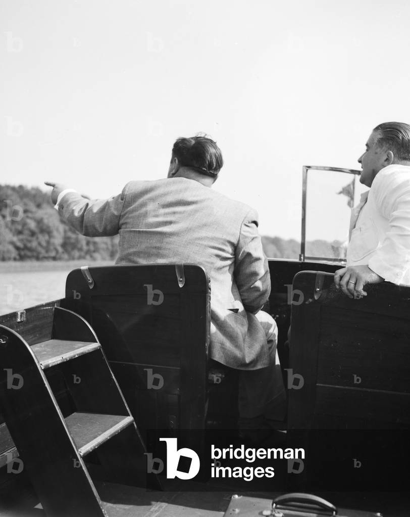 A man on a lake in his motor boar, Germany 1930s (b/w photo)
