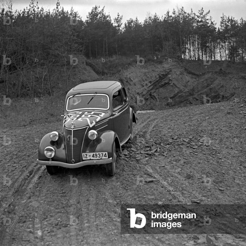 A Ford model Eifel at a car rallye, Germany 1930s (b/w photo)