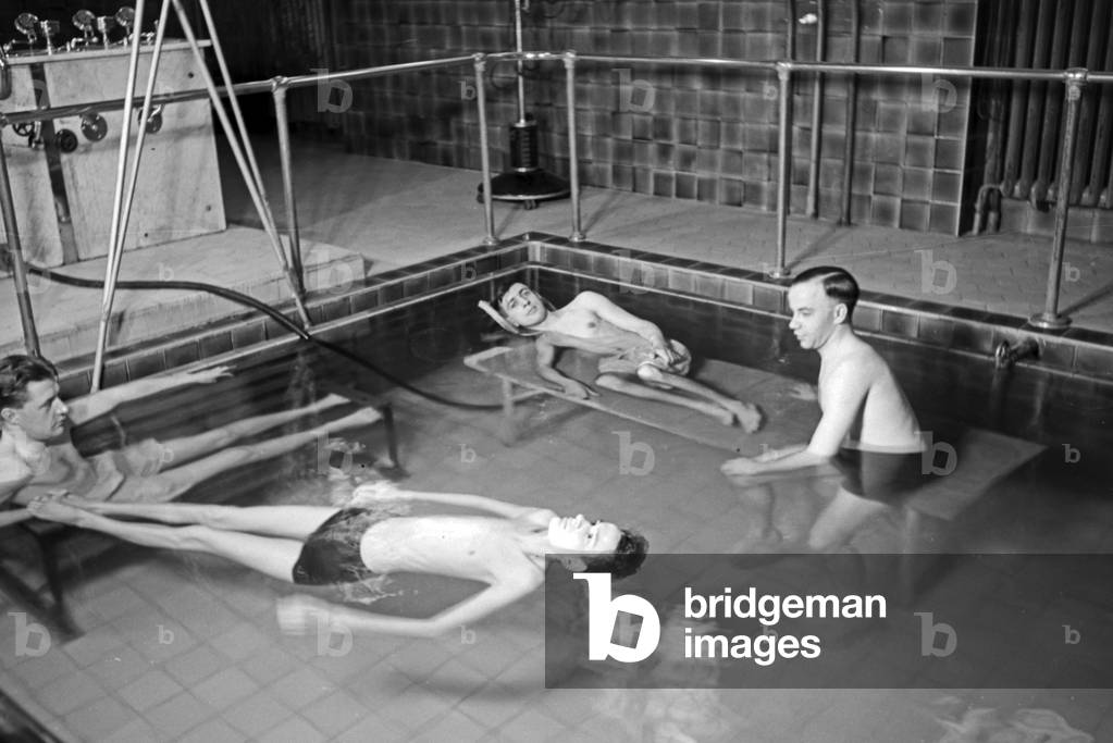 Three patients in a therapeutic bath, Germany 1930s (b/w photo)
