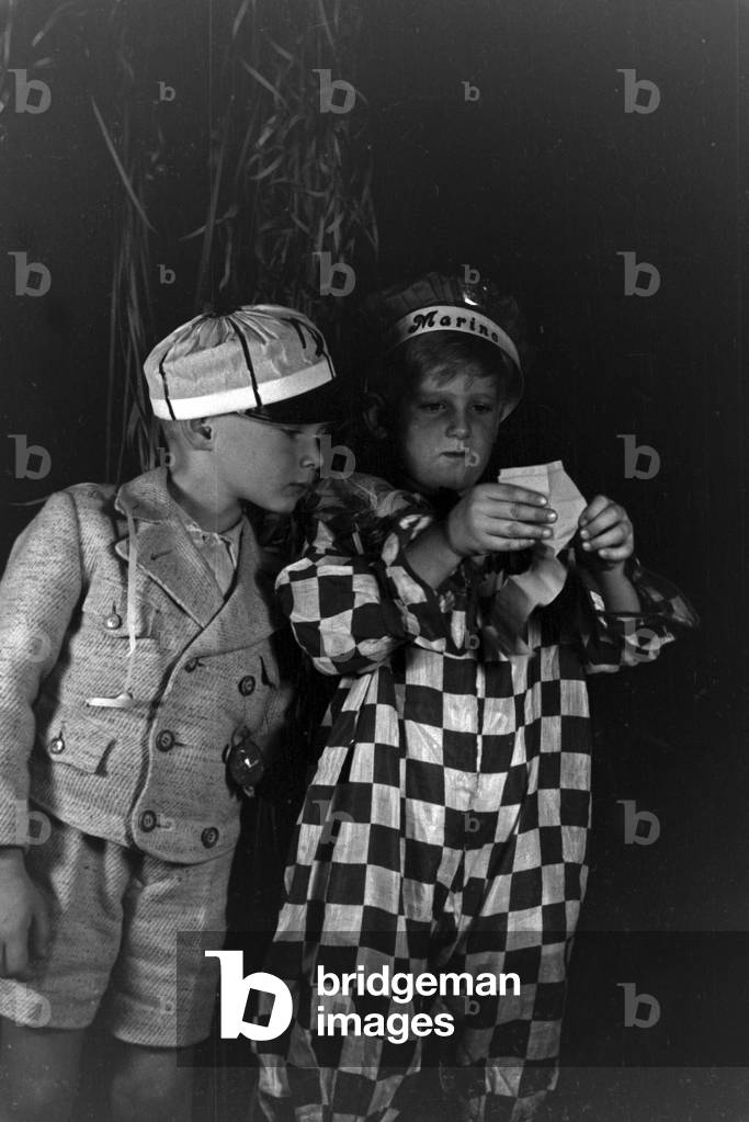 Two little boys dressed for a carnival, Germany 1930s (b/w photo)