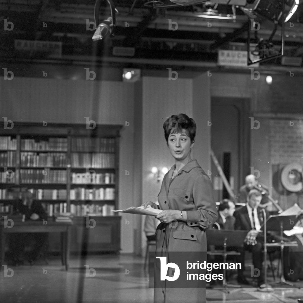 German schlager singer Renee Franke doing rehearsals with the orchestra of Norddeutscher Rundfunk conducted by Franz Thon at Hamburg, Germany 1960s