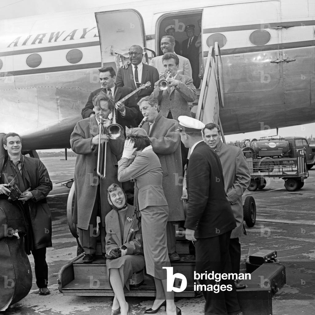 Shortly after leaving the plane the Chris Barber Band is playing music at Hamburg airport, Germany 1950s