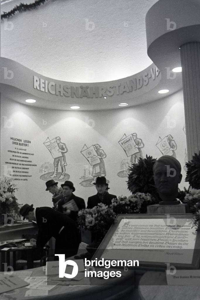 A stand by the organisation Reichsnährstand with a bust of Adolf Hitler on the occasion of the Wiener Modewoche in the house of fashion 