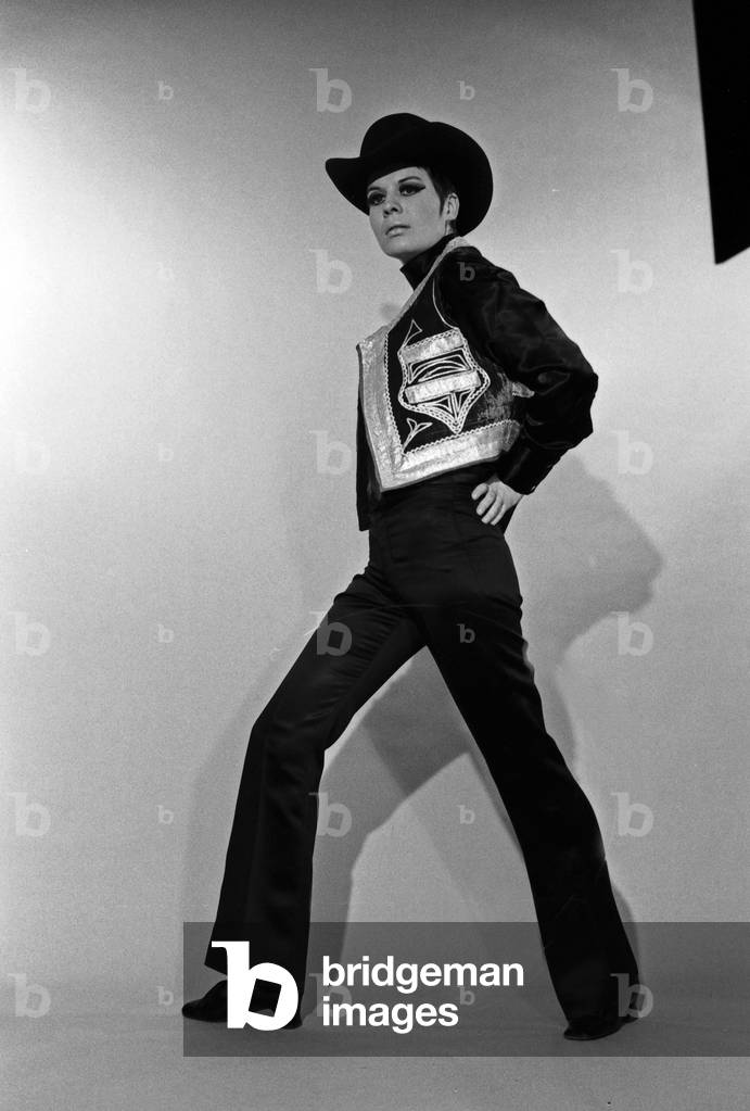 Model Petra posing as a cowboy for German TV magazine 