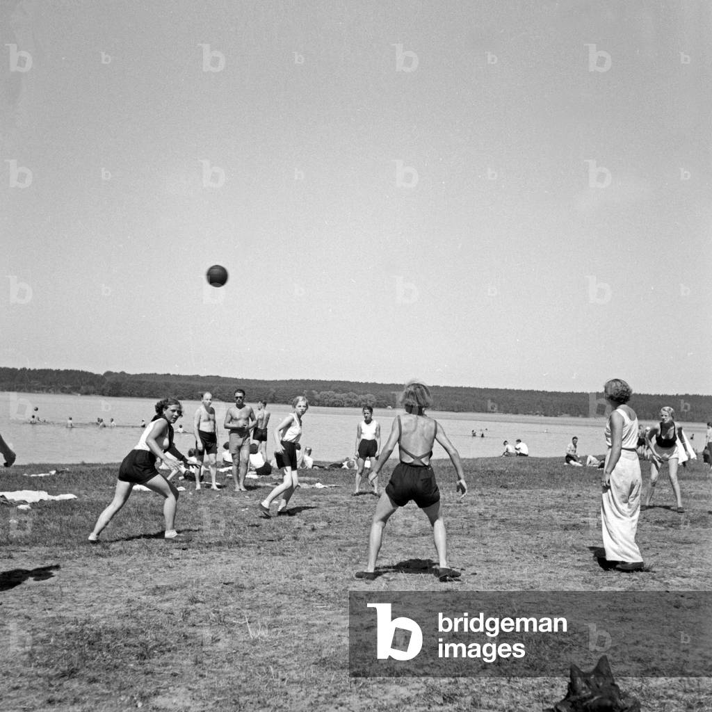 Girls playing with a ball at leisure camp of Deutsche Arbeitsfront in Altenhof, Brandenburg, 1930s (b/w photo)