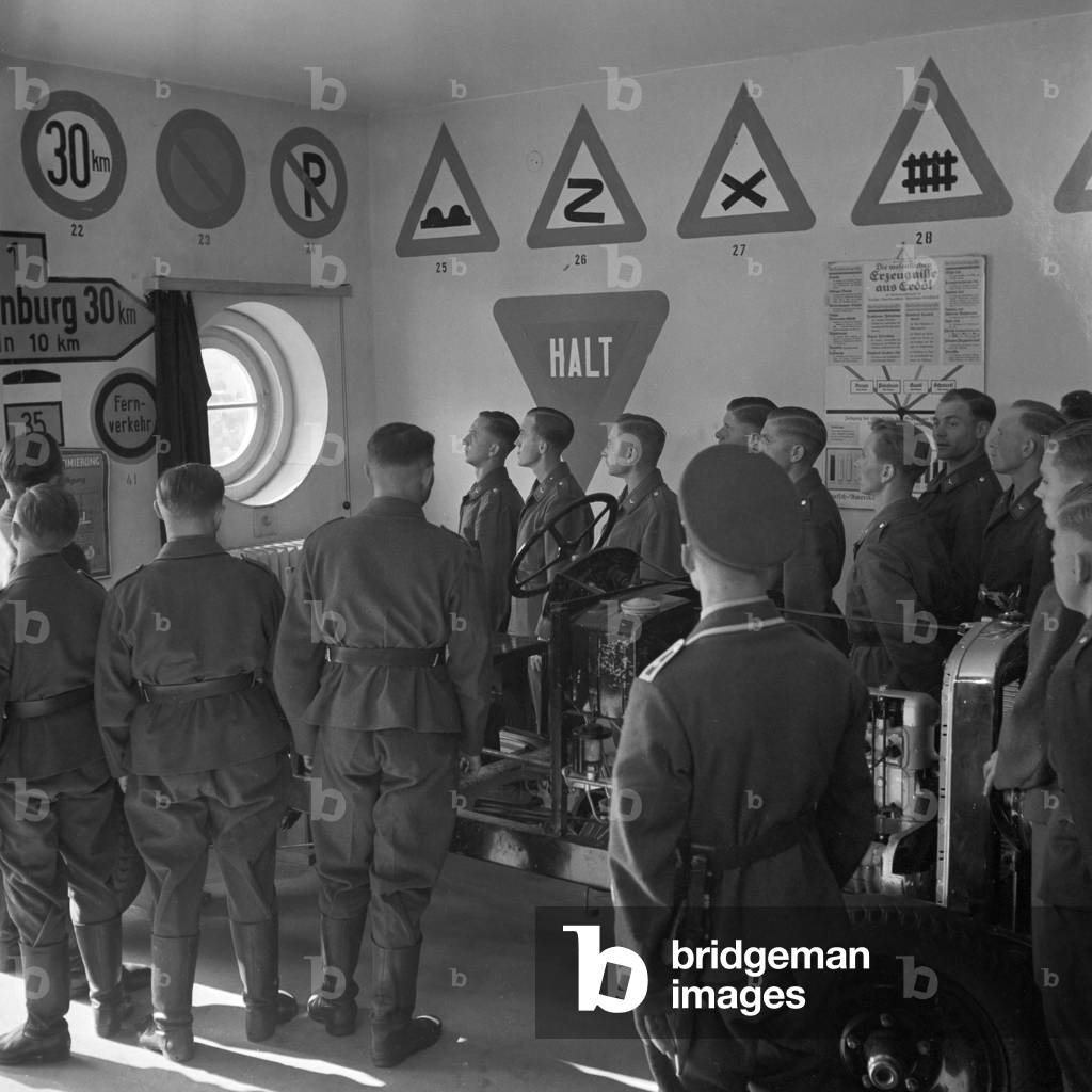 Lessons on traffic signs like at all motorized troops, Germany 1940s (b/w photo)