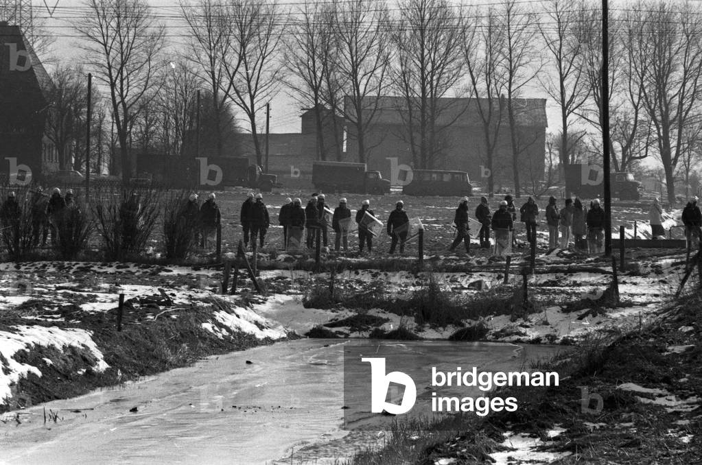 Police scanning the area around Brokdorf nuclear plant, Germany 1980s