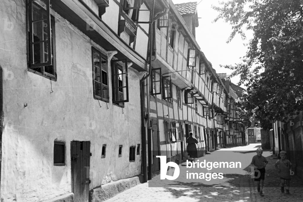 A street with half timbered buildings in Bruchsal, Germany 1930s (b/w photo)
