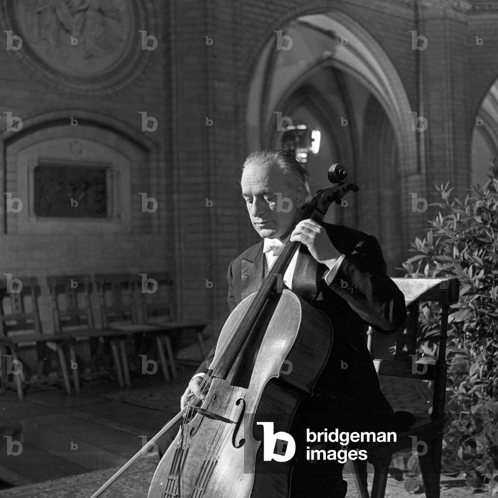 A cello player a few moments before his concert in a church at Hamburg, Germany 1960s