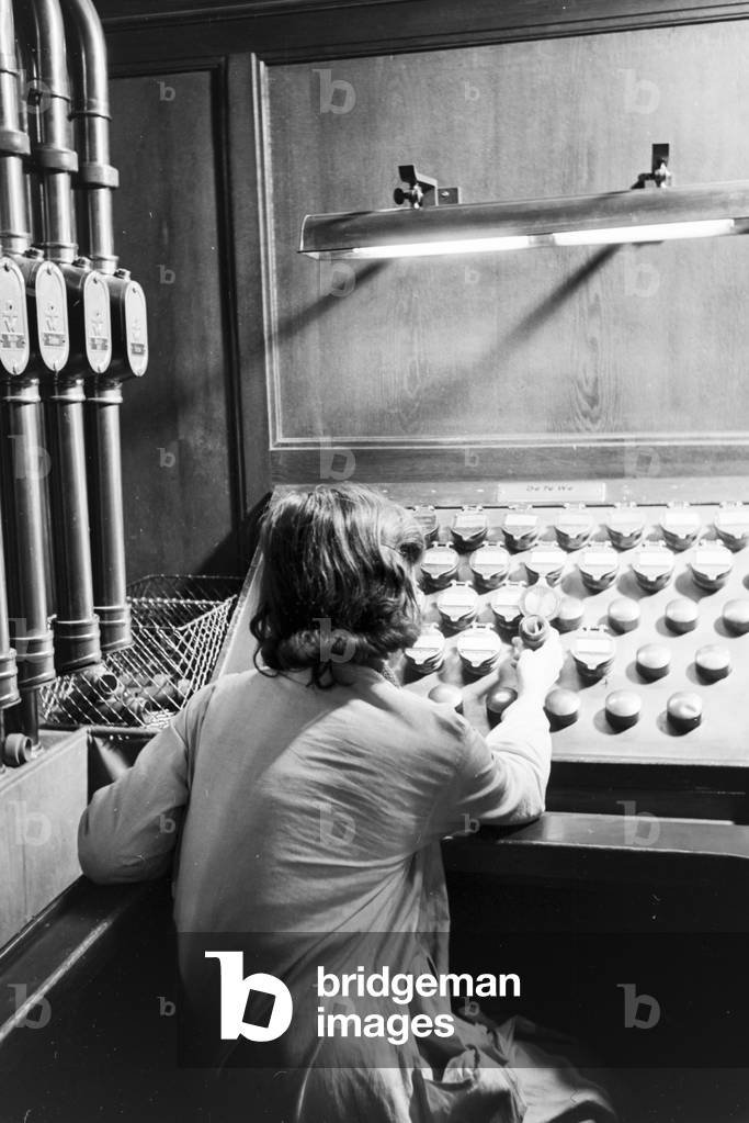 The pneumatic tube transportation system of the Berlin State Library (former Prussian State Library), Germany 1930s (b/w photo)