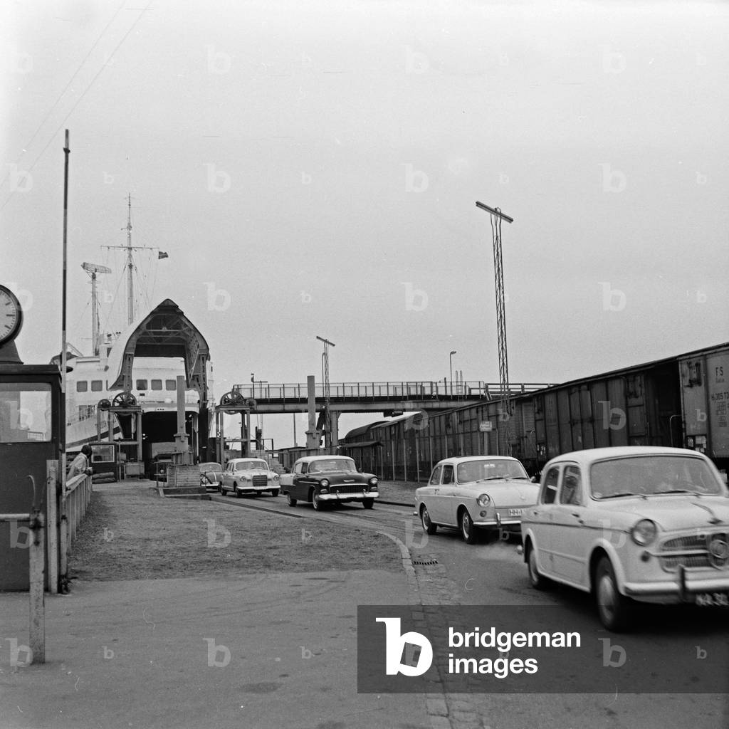 Cars leaving the ferry boat at Puttgarden harbor, Germany 1960s